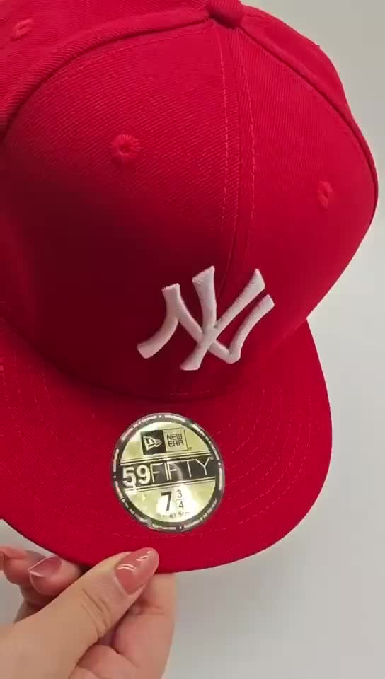 Red NY baseball cap close-up from the supplier detail video